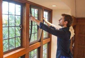 A man installing a window insert